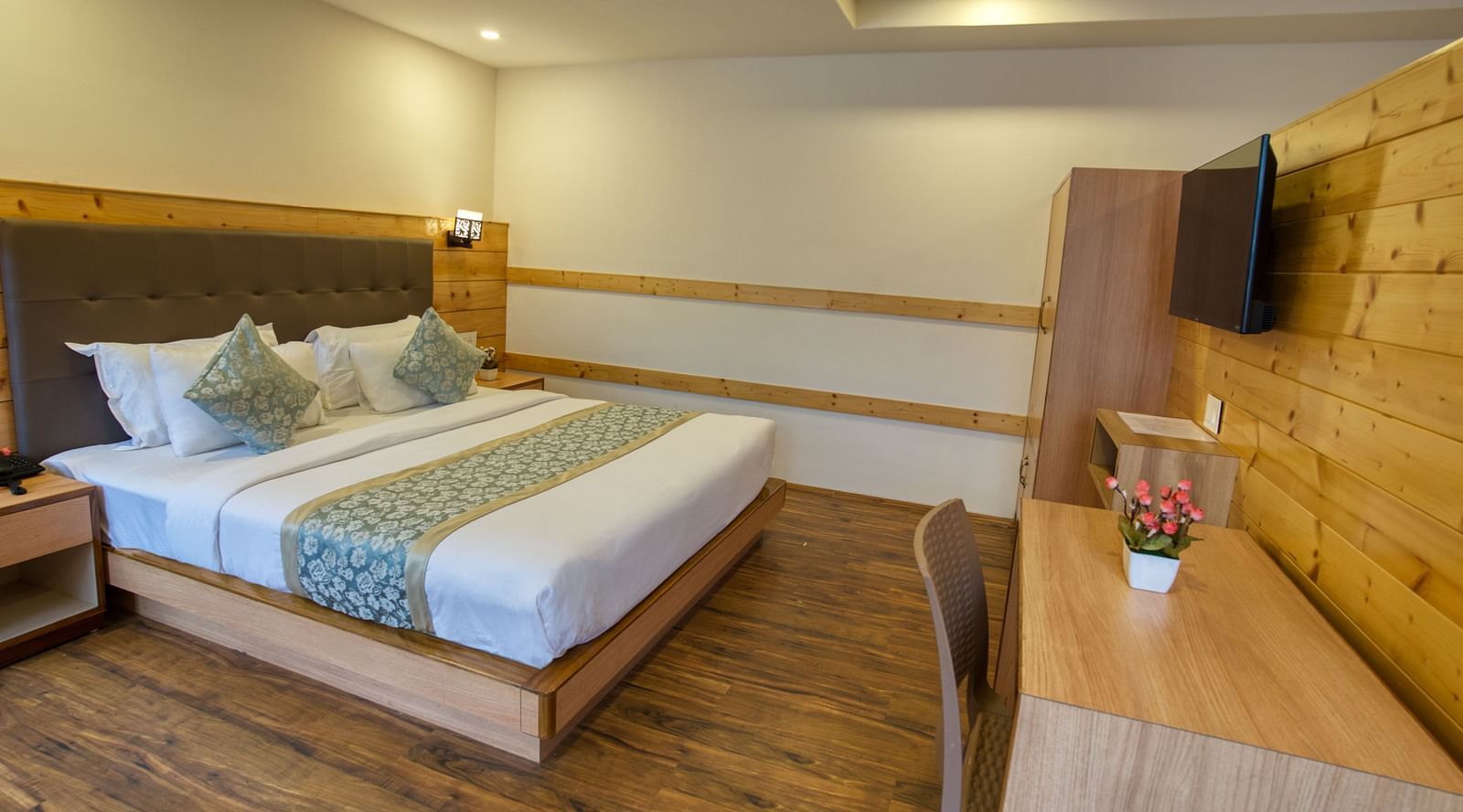 A image of the family suite with bed and TV in front I Avianna Gangtok Prime Hotel & Spa