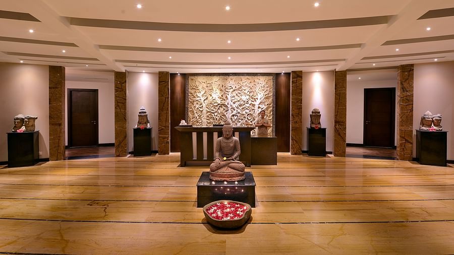 The entrance to Mudra Spa decorated with unique artefacts and with wooden floors 