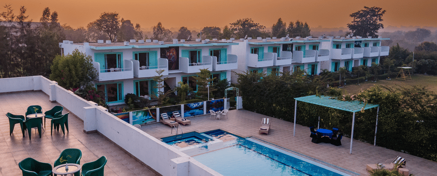 Facade of The Mallard Corbett with terrace seating and swimming pool
