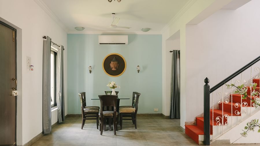 Elegant dining area with classic wooden furniture in the Three BHK Deluxe Villa at Richmonde Ananta Elite, Goa.