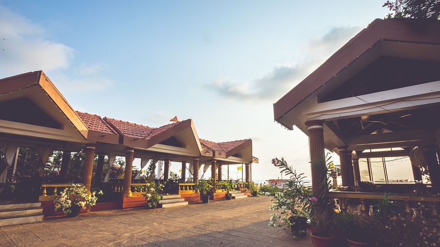 A wide view of the beach-side seating of a restaurant at Paradise Isle Beach Resort, Udupi