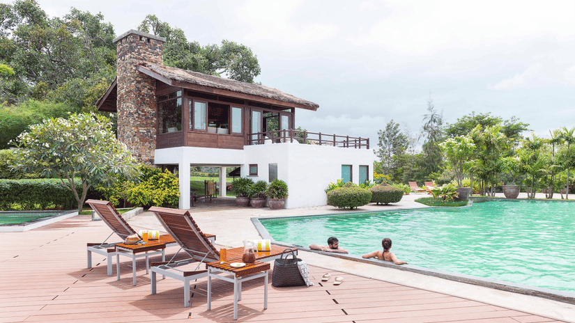 People swimming in the pool at The Serai Bandipur