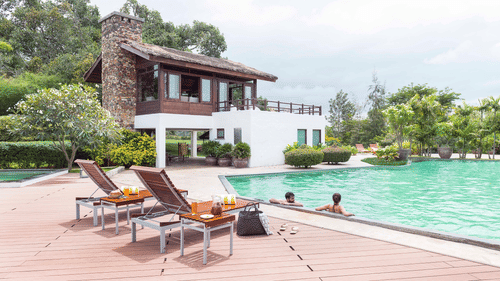 People swimming in the pool at The Serai Bandipur