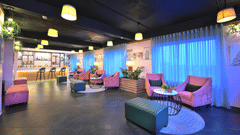 An image of Panora Bar in Agra with comfortable couches placed around coffee tables - Rooftop in Agra  - Golden Tulip, Agra