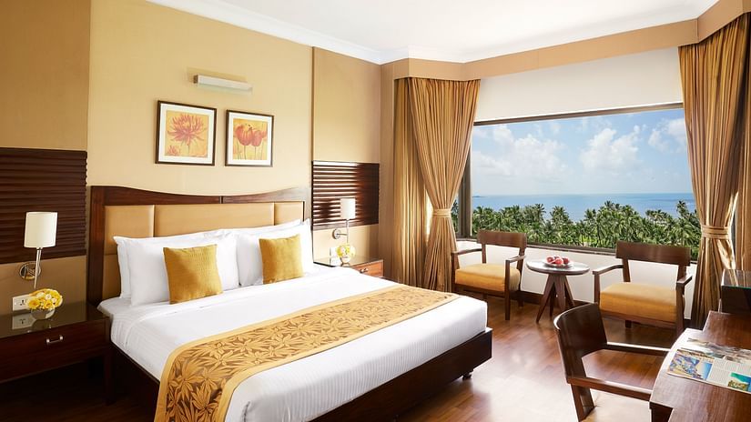 a double bed in a hotel room with a picturesque view 089