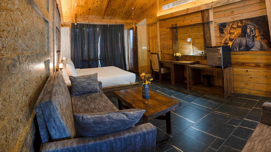 A view of the Master Suite with a large bed at the Sylvan Retreat, Dehradun.