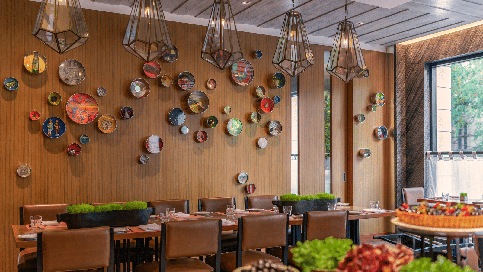 Indoor restaurant with colorful wall decor and dining tables at The Raintree, St. Mary’s Road.