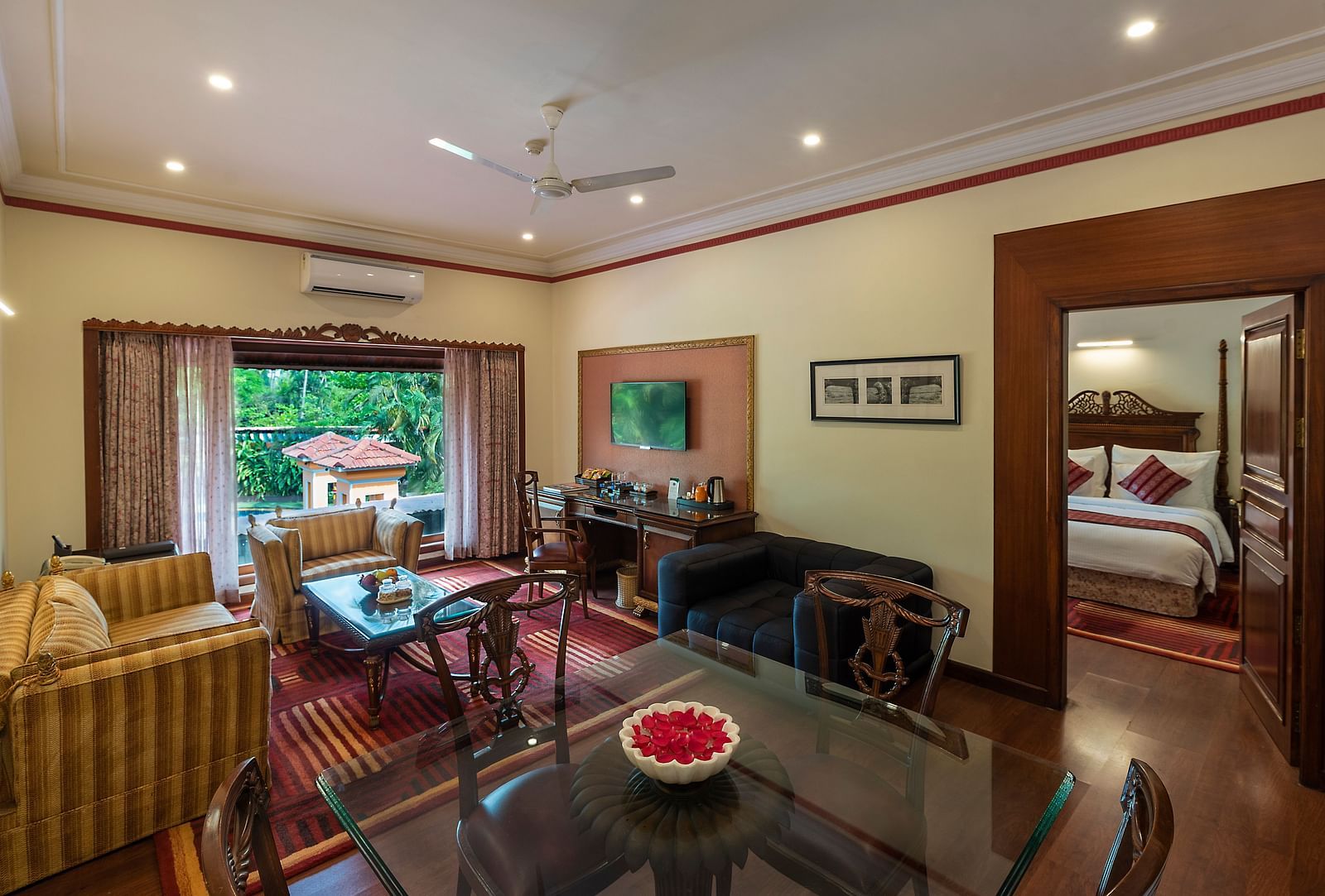 the living room decked with a sofa set and a TV - Mayfair Lagoon, Bhubaneswar