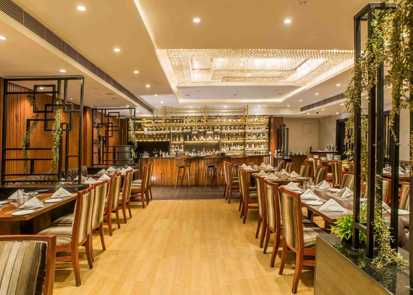 Elegant hotel restaurant with neatly arranged tables and chairs and subtle lighting | The Citi Residenci Hotel Durgapur