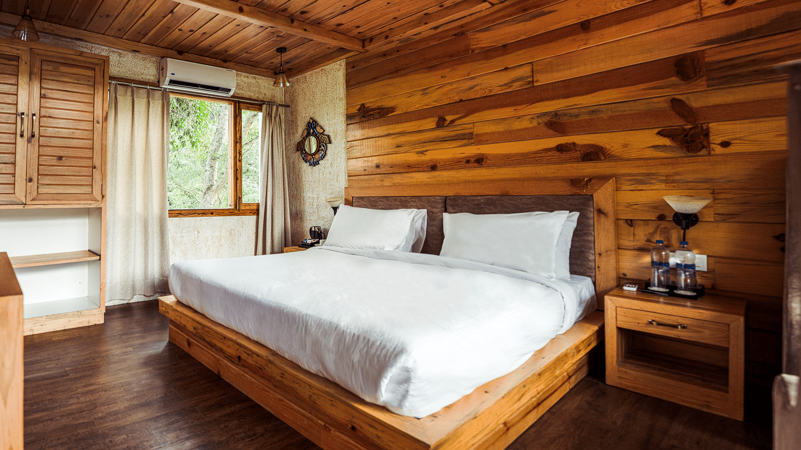 A view of the large bed at Pinewood Cottage at the Sylvan Retreat, Dehradun.