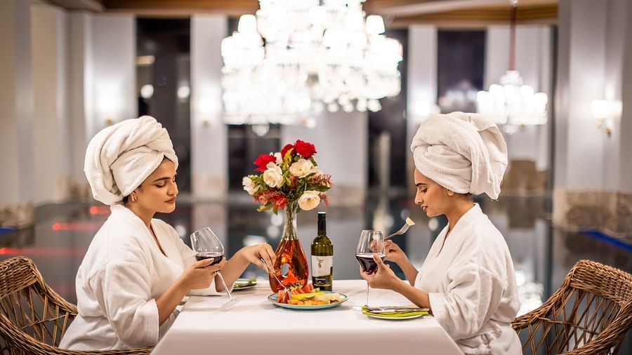 Two people enjoying food by the side of a pool  - The Manor Luxury Hotel, Shimla
