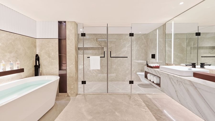A full view of bathroom with a bath tub | The Resort