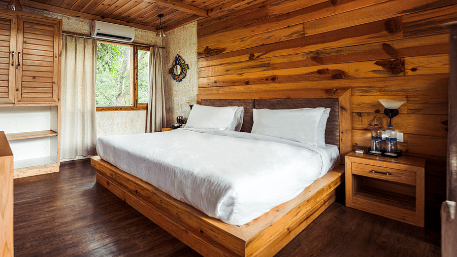 A view of the large bed at Pinewood Cottage at the Sylvan Retreat, Dehradun.