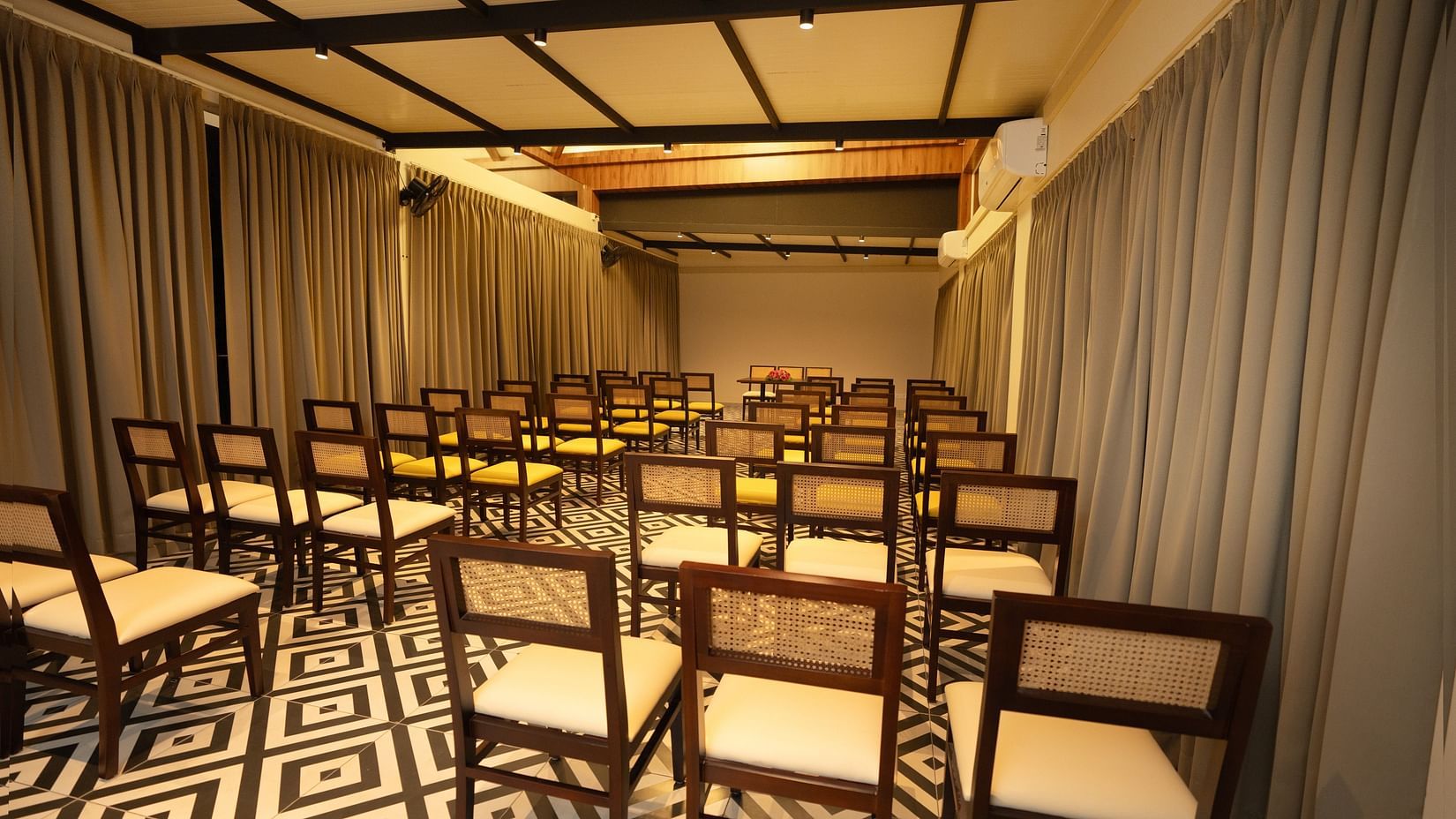 A back view of chairs in a room | Misty Queen by Dimora, Kakkadampoyil