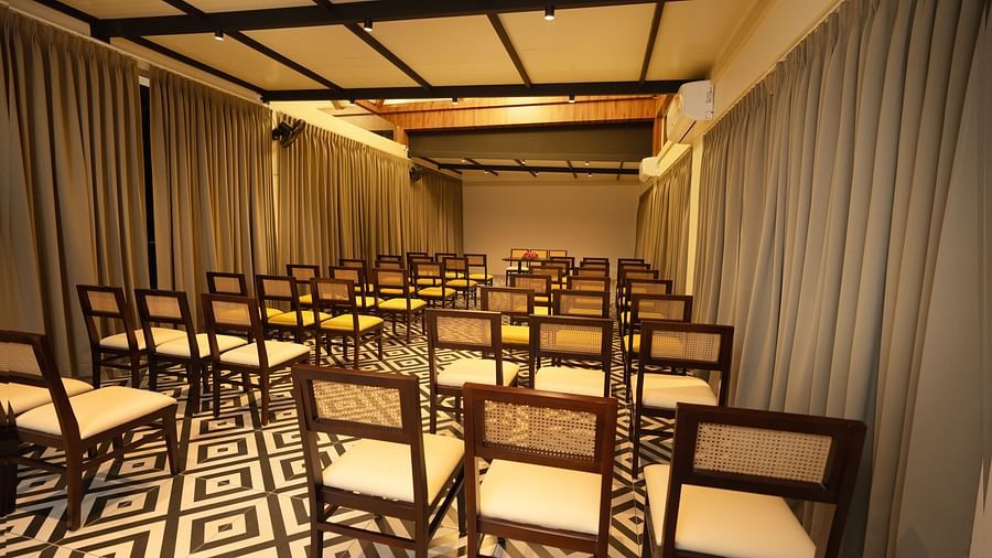 A back view of chairs in a room | Misty Queen by Dimora, Kakkadampoyil