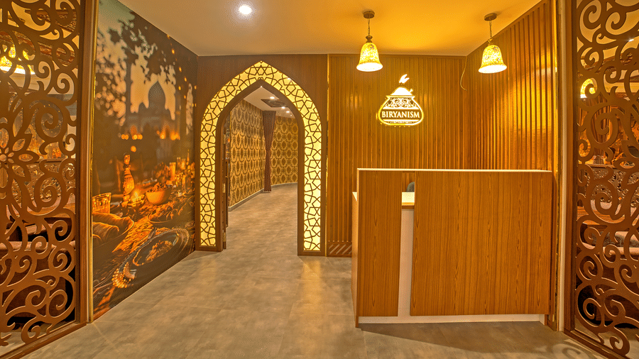 Entrance of a restaurant with illuminating yellow lights at Ilara Hotels & Spa, OMR, Chennai