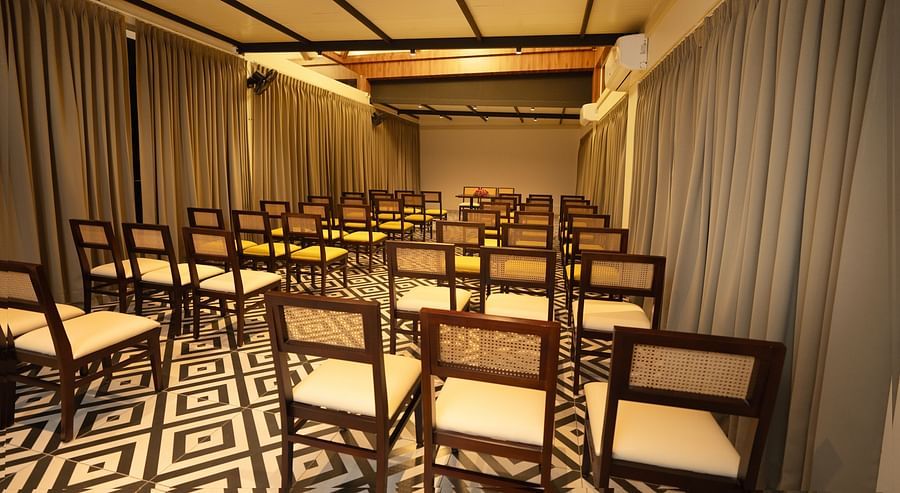 A back view of chairs in a room | Misty Queen by Dimora, Kakkadampoyil