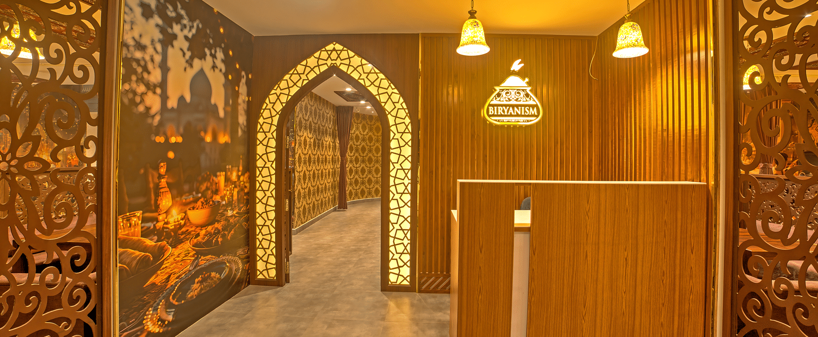 Entrance of a restaurant with illuminating yellow lights at Ilara Hotels & Spa, OMR, Chennai