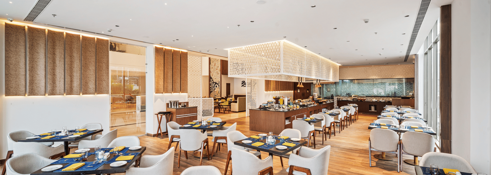 A dining setting at Grand Vijayawada Restaurant at Grand Vijayawada by GRT Hotels.