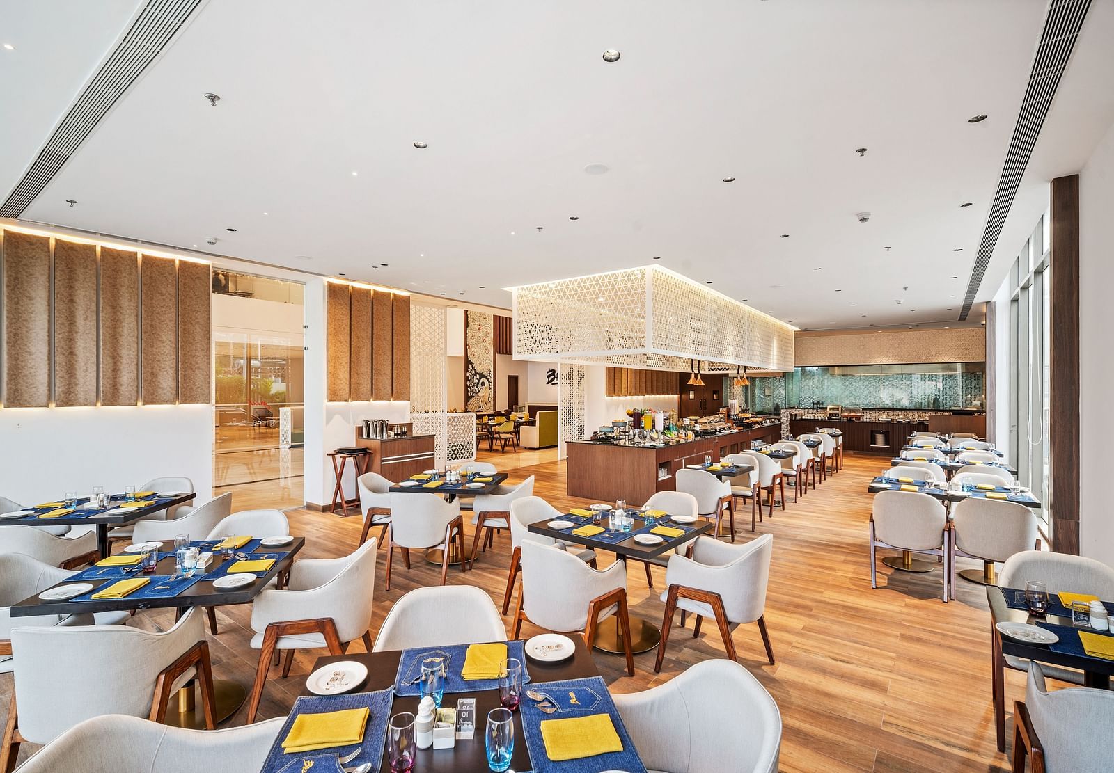A dining setting at Grand Vijayawada Restaurant at Grand Vijayawada by GRT Hotels.