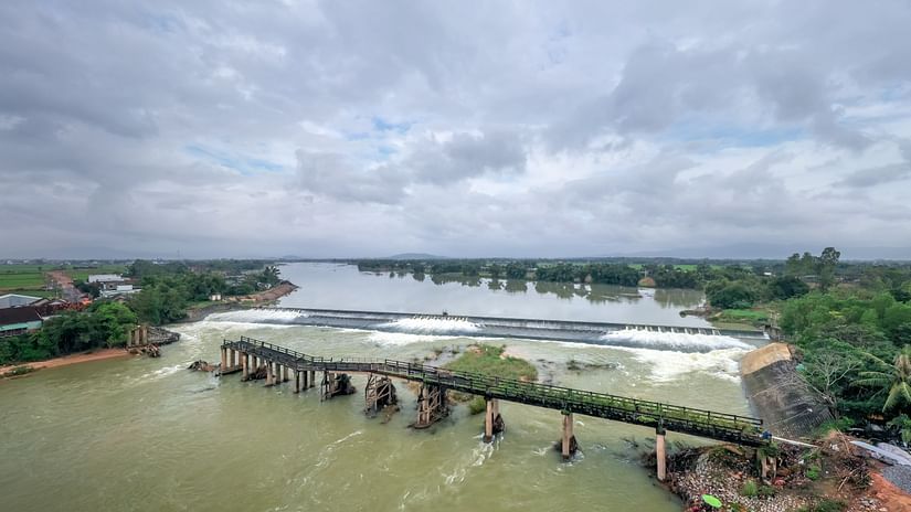 overview of a Broken bridge of a reservoir with white clouds in the sky