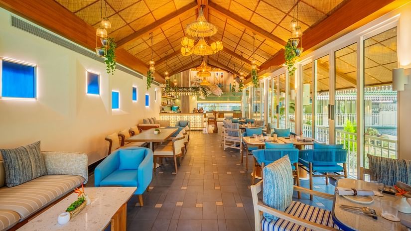 Bright and airy dining space featuring comfortable seating, soft lighting, and a blend of natural and contemporary design elements.