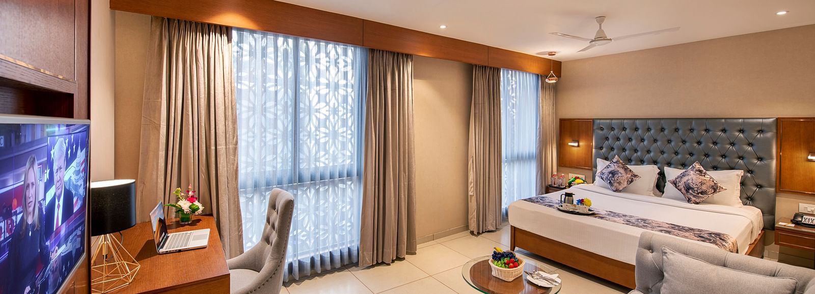 A well-appointed hotel room with a double bed - SK Lords Inn Ahmedabad