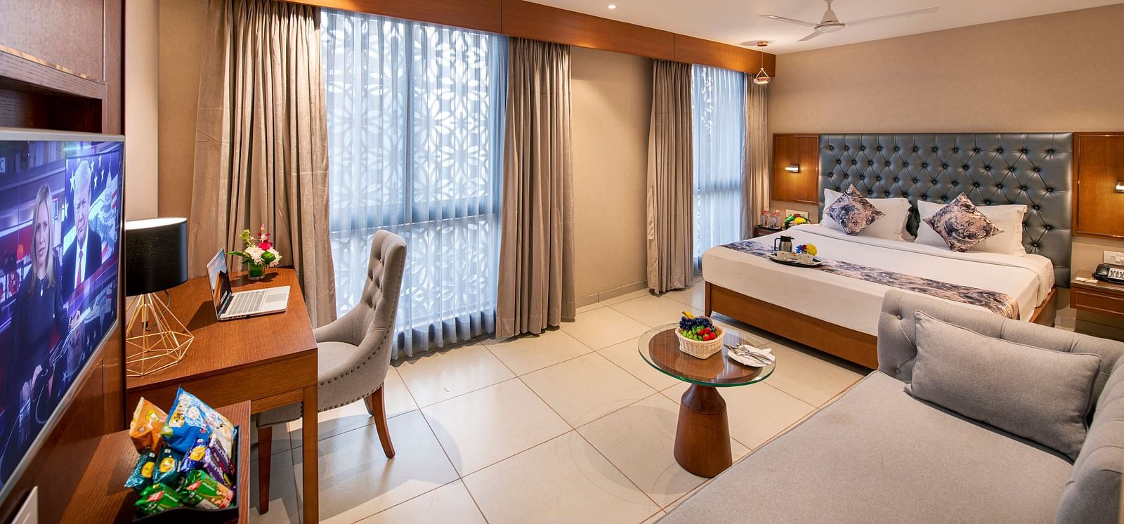 A well-appointed hotel room with a double bed - SK Lords Inn Ahmedabad