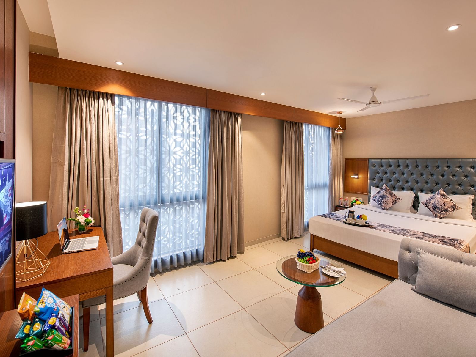 A well-appointed hotel room with a double bed - SK Lords Inn Ahmedabad