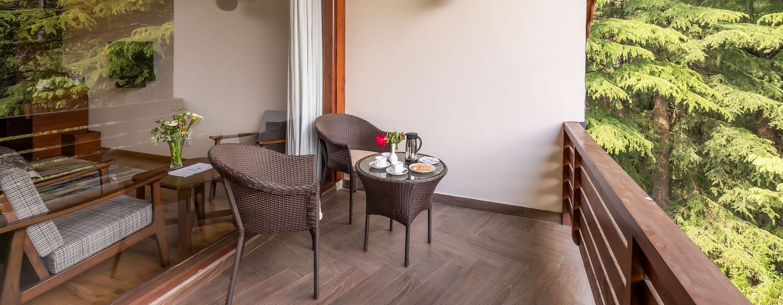 balcony of superior room with a chairs and a view at Bedzz Xclusive Baikunth, Manali