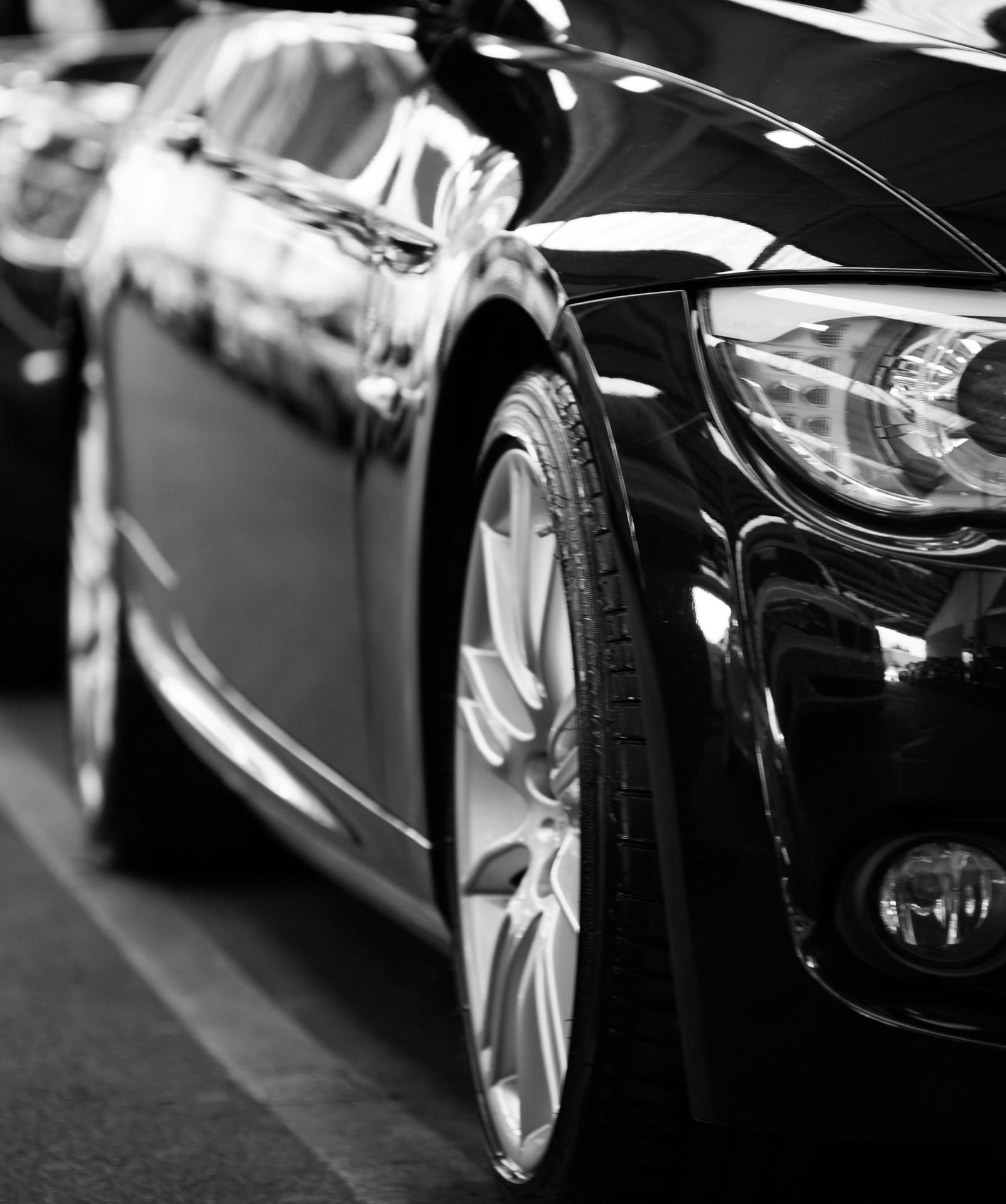Row of cars parked in a line.