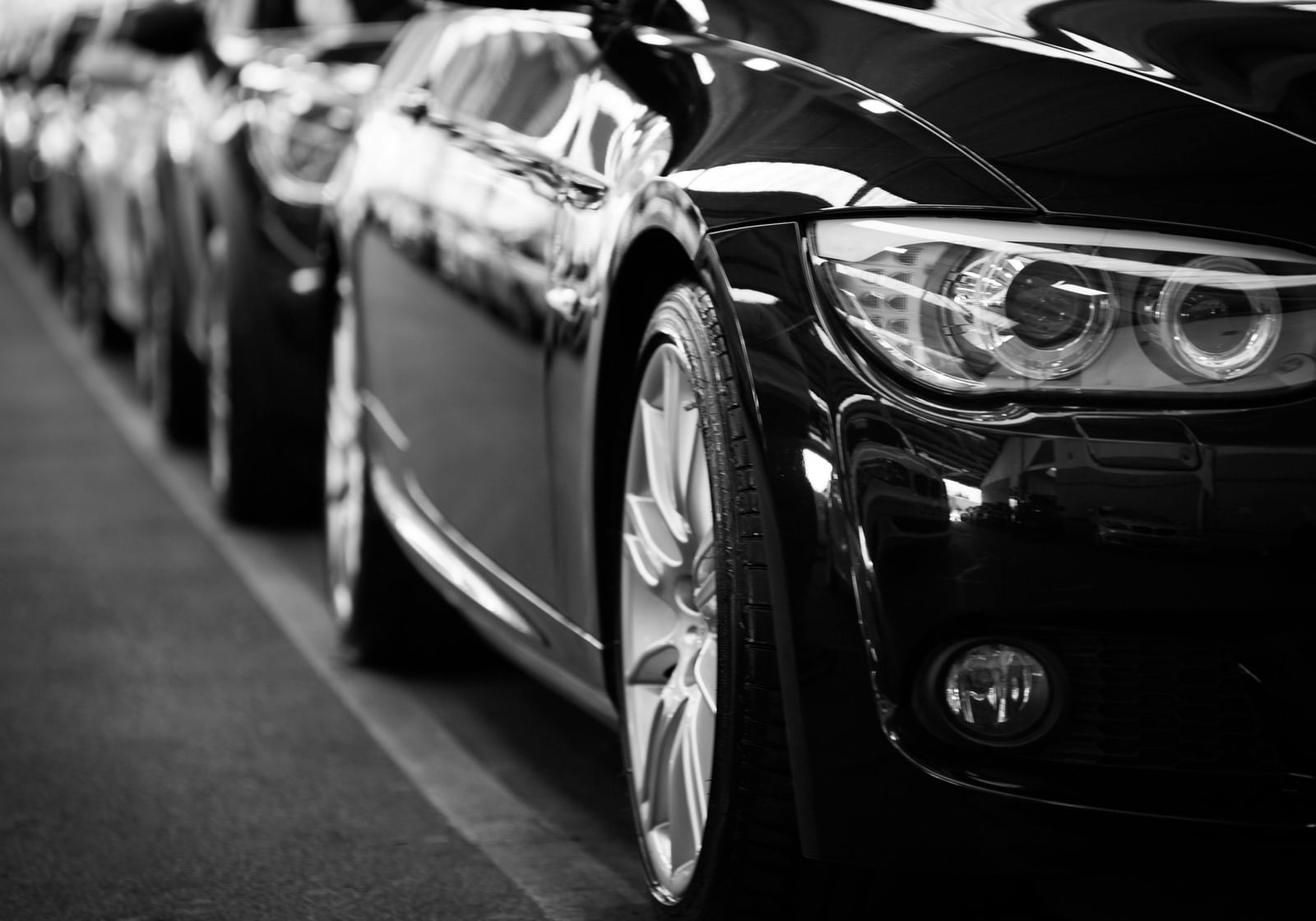 A close up of a cars parked in-line