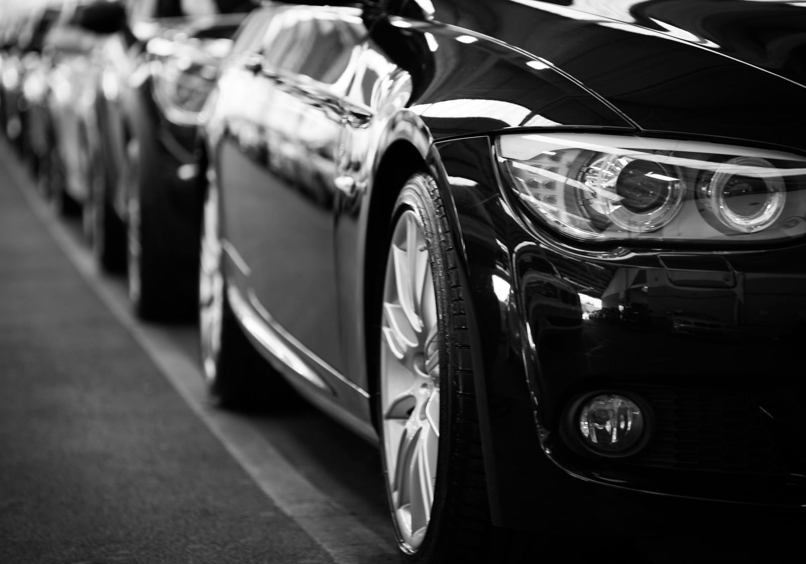 A close up of a cars parked in-line