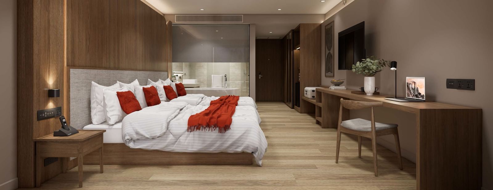 Modern bedroom with king bed, wooden decor, and desk at Ramada Resort by Wyndham Khao Lak.