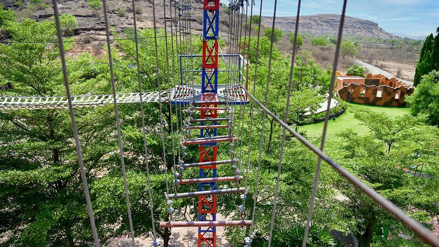 High ropes adventure course with scenic views in a lush green setting | Diamond Parks, Pune 