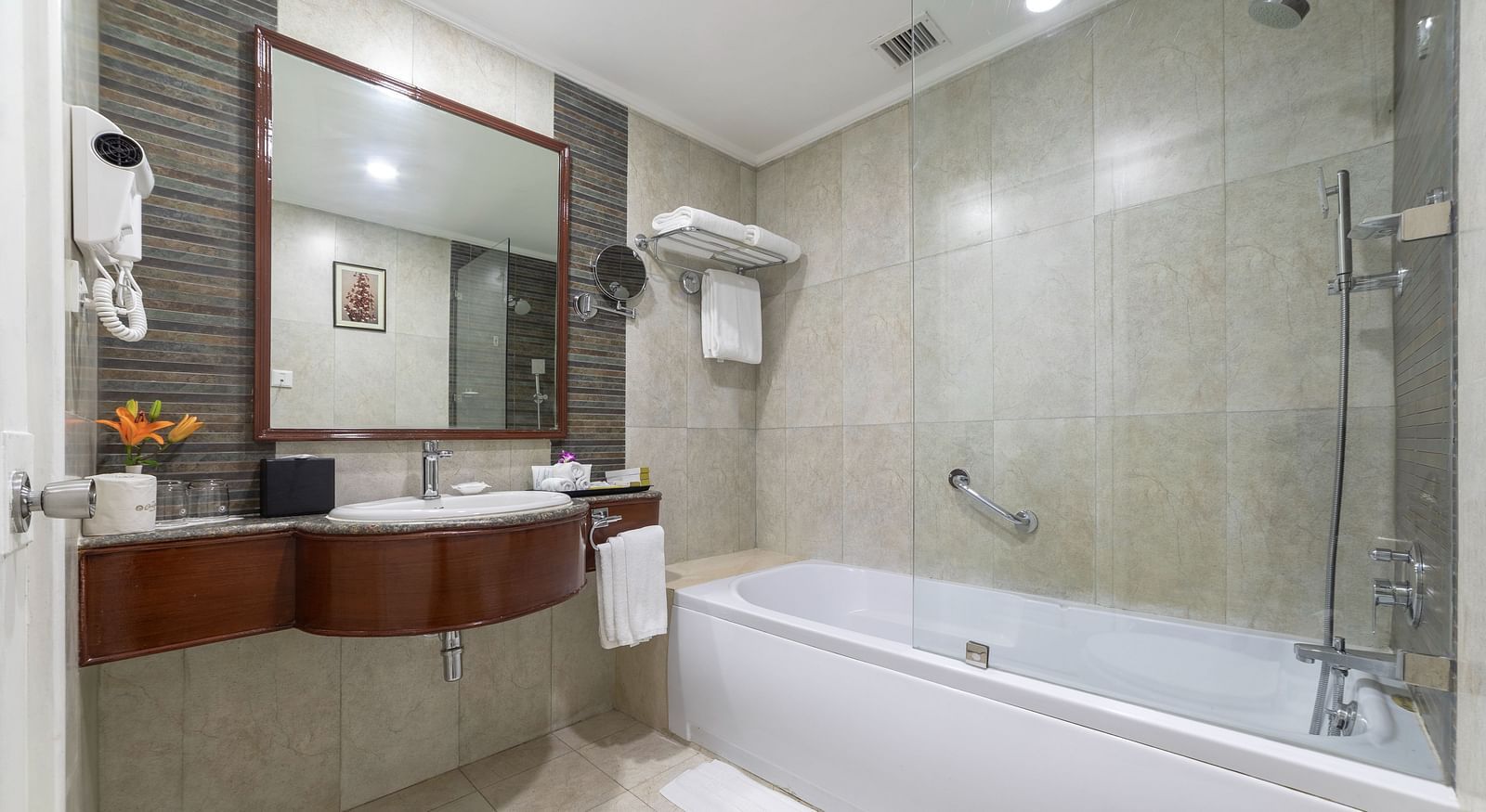 Bathroom of Shiraz Premium Room with a bathtub alongside a vanity area