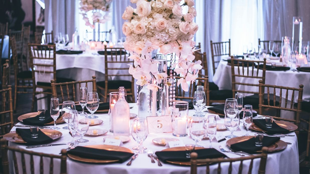 an image of a banquet hall with a flower vase kept on the table