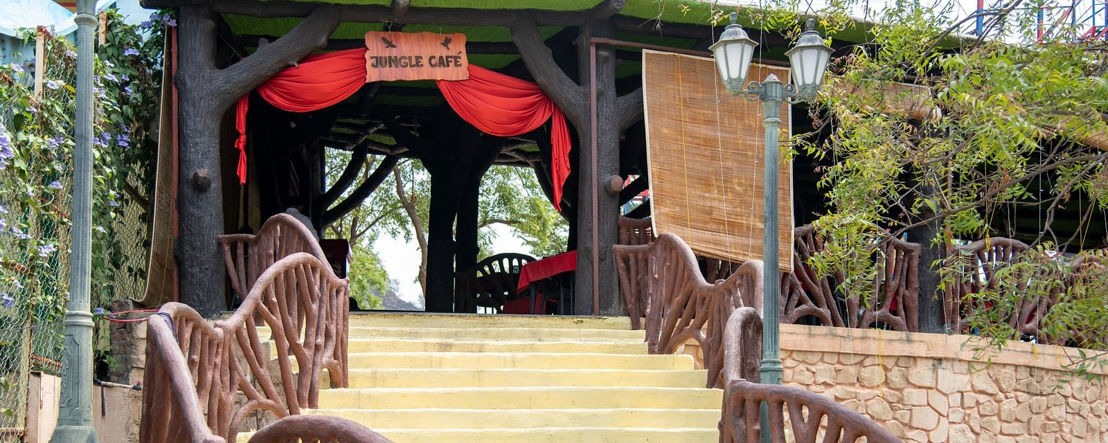 A picture of jungle cafe which has a welcome sign at the entrance | Diamond Parks, Pune