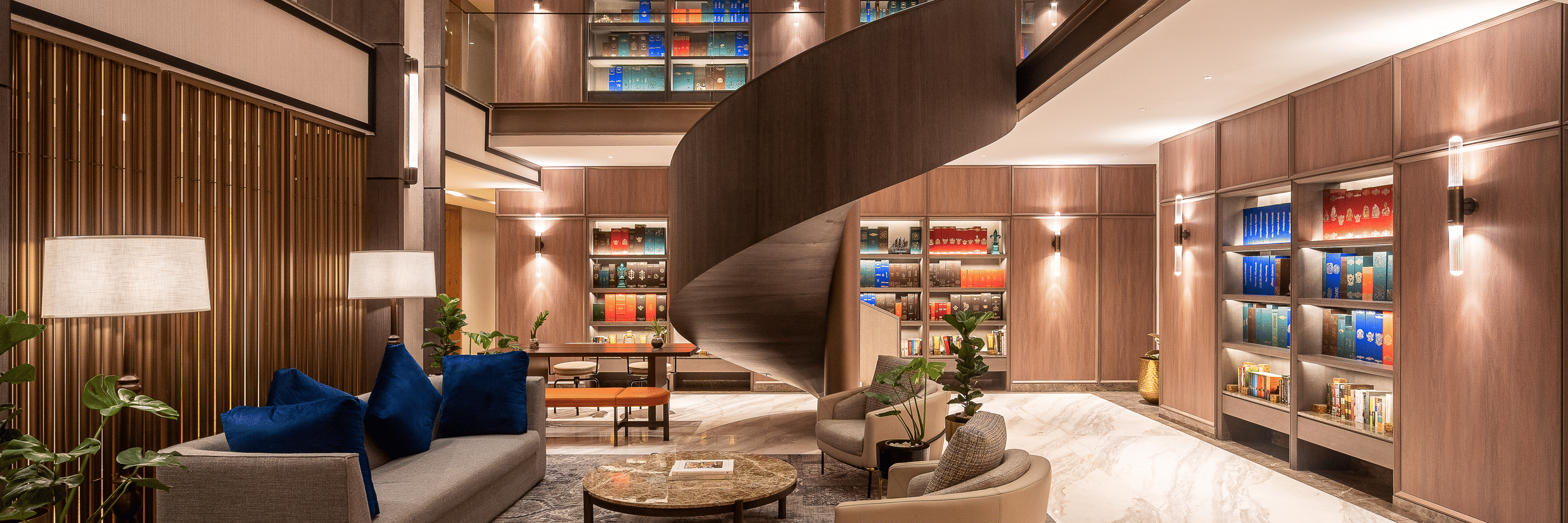 A lounge area at The Residency Towers Chennai with a unique bar counter, seating, and decorative elements.