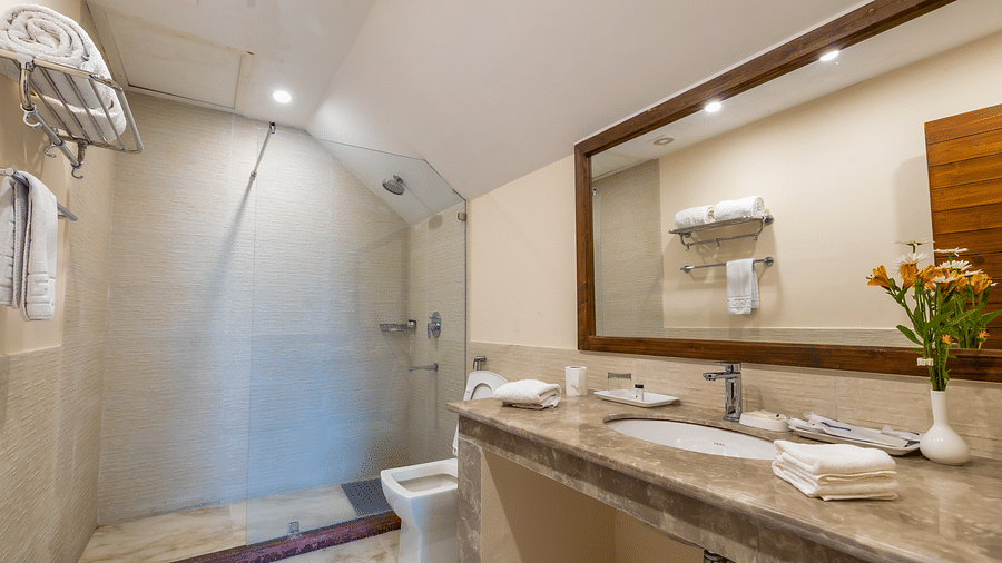 washroom in Premium room at Bedzz Xclusiv Baikunth, Manali