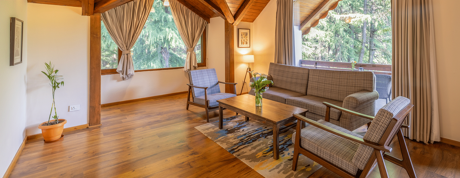 xclusiv room with a sofa setting with lavish wooden interiors at Bedzz Xclusiv Baikunth, Manali