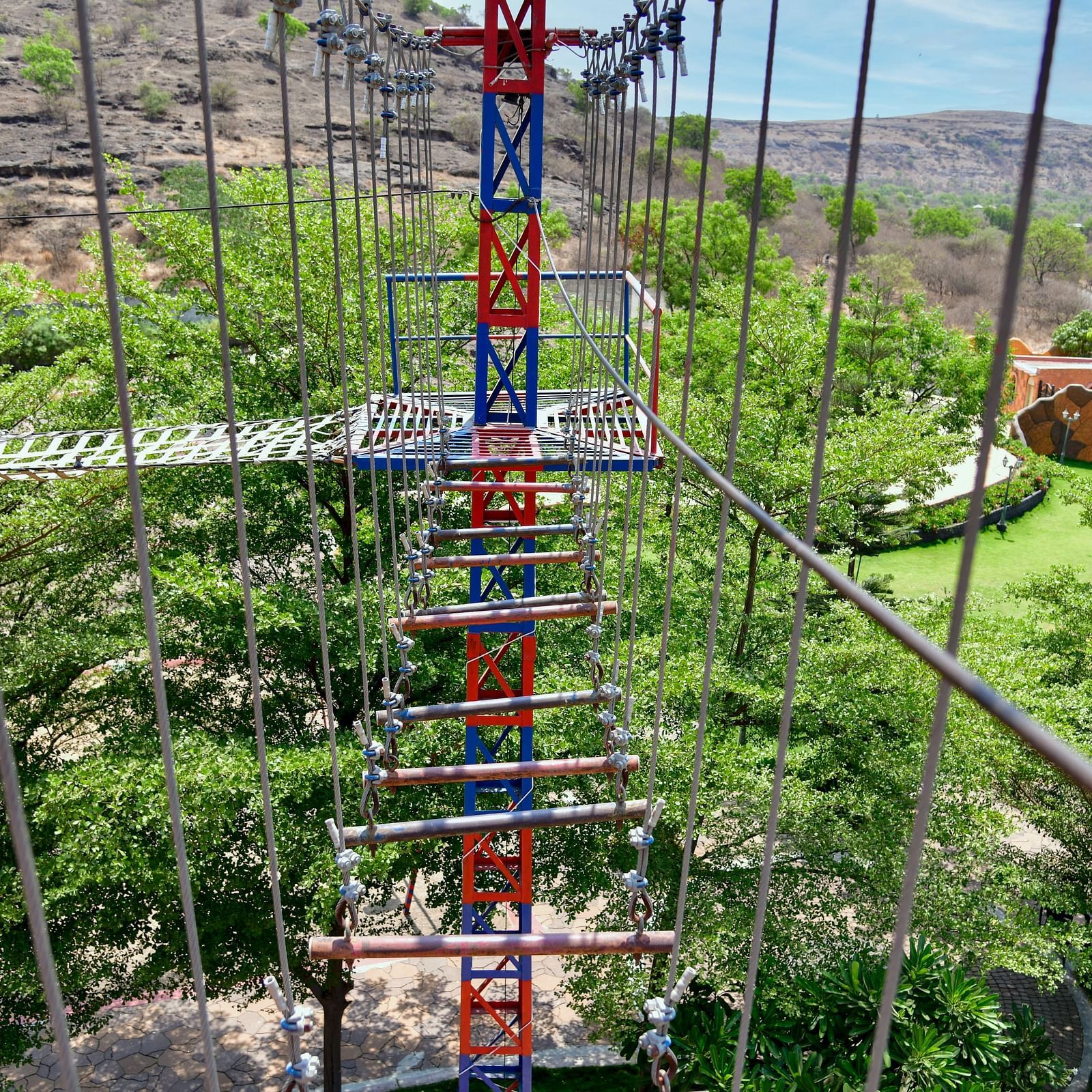 High ropes adventure course with scenic views in a lush green setting | Diamond Parks, Pune 