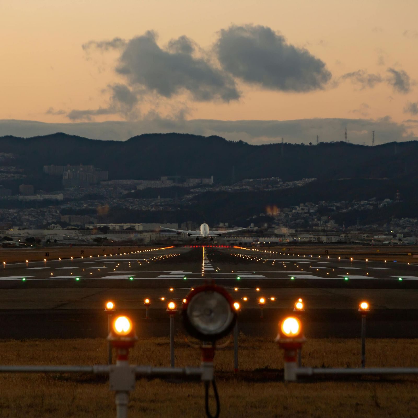 An image of the airport zone where two planes are flying