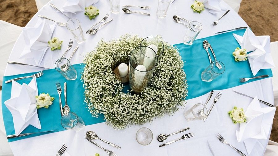 top view image of the dining table decorated with flowers and cloth napkins with well set cutlery - Maikhao Dream Villa Resort & Spa, Phuket