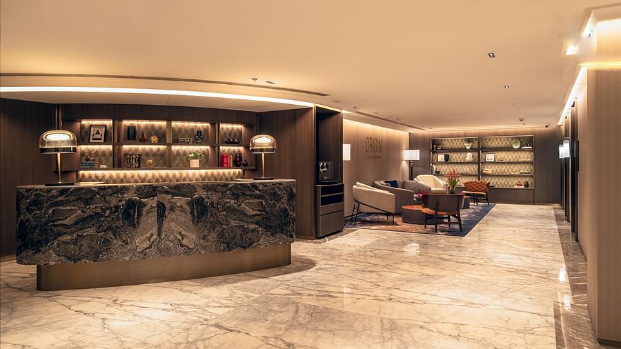 A lounge area at The Residency Towers Chennai with a unique bar counter, seating, and decorative elements.