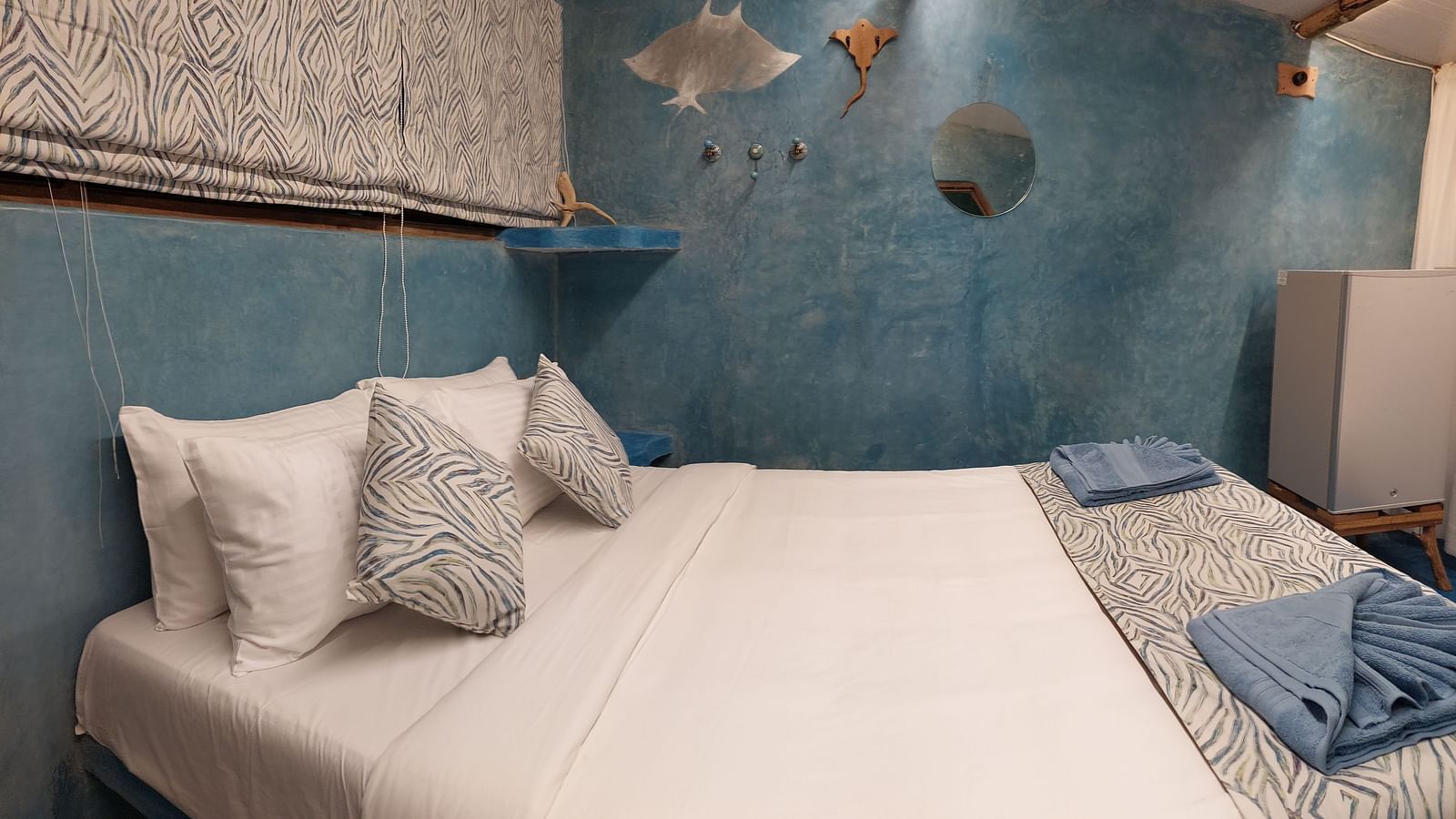 A bed with bedding | Matsya Island Retreat