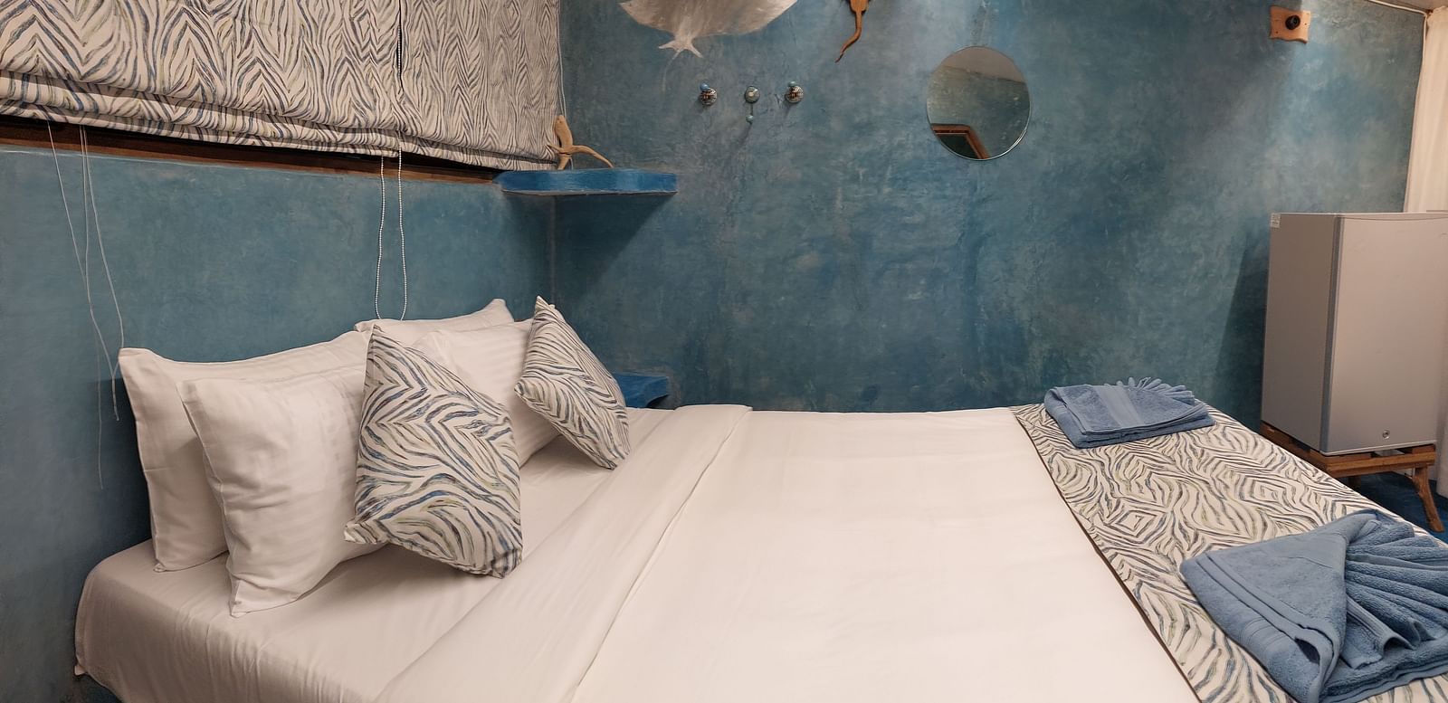 A bed with bedding | Matsya Island Retreat