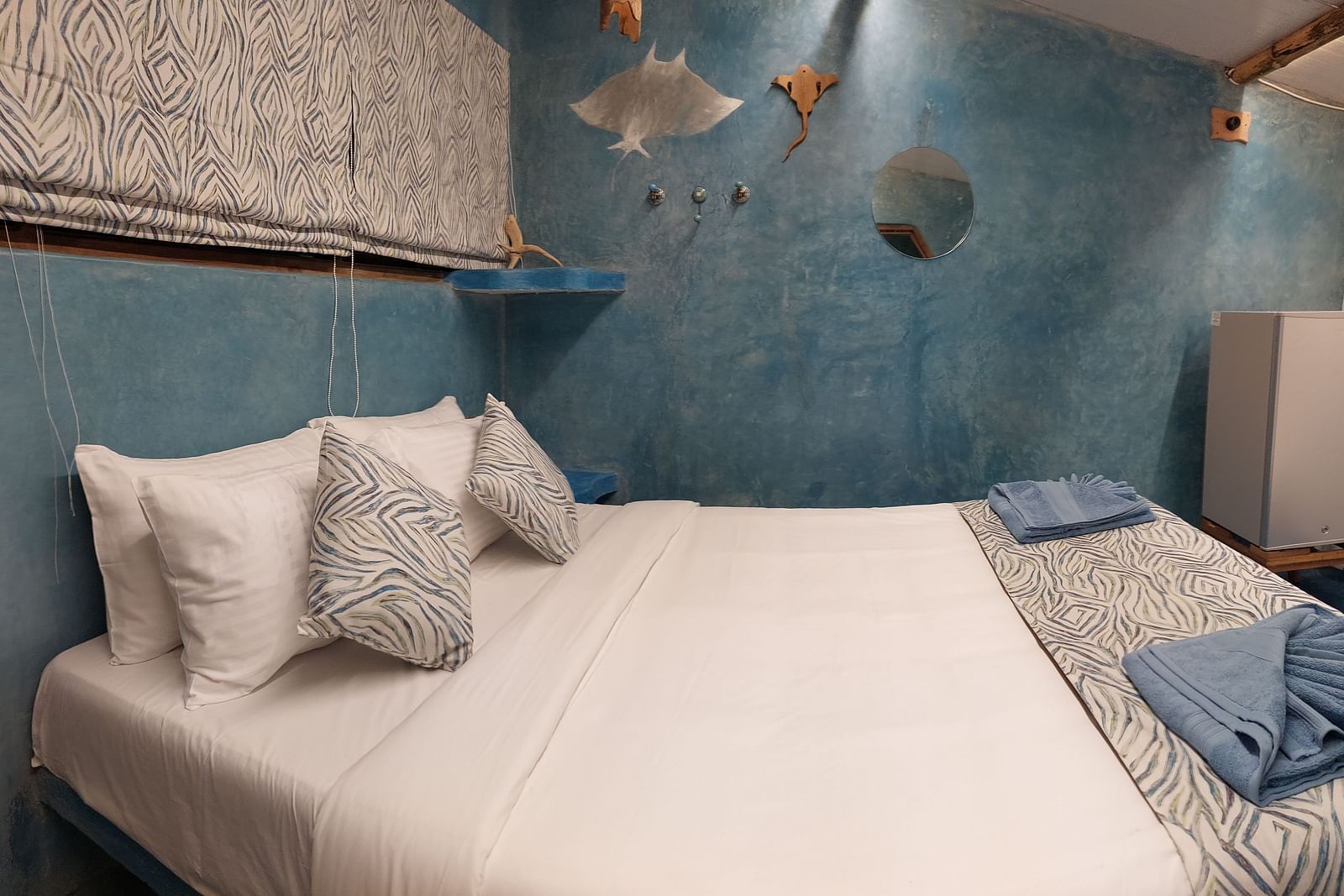 A bed with bedding | Matsya Island Retreat