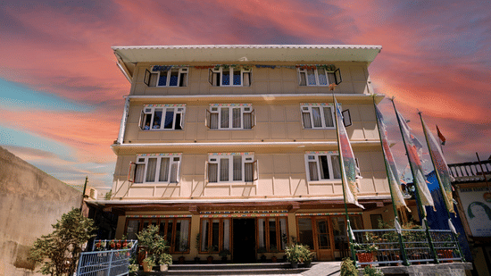 Mount magnolia hotel l facade captured during sunset with warm lighting and symmetrical design.