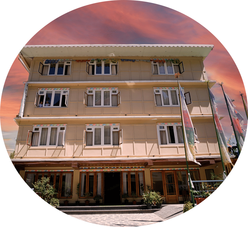 Mount magnolia hotel l facade captured during sunset with warm lighting and symmetrical design.